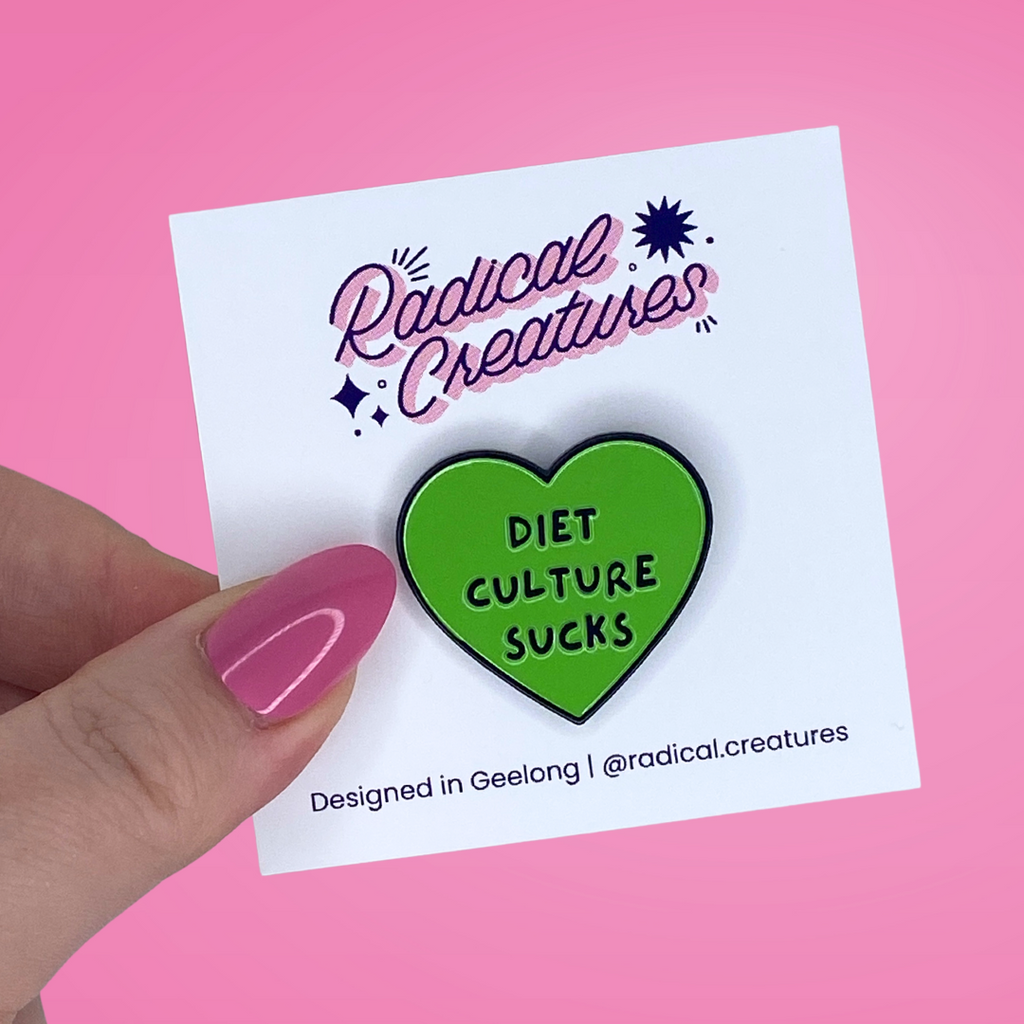 Heart shaped pin. Green with text "diet culture sucks"